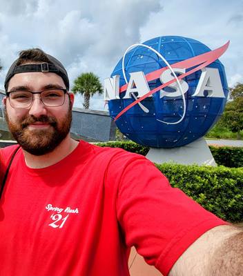 Miland Myers picture in front of NASA sign