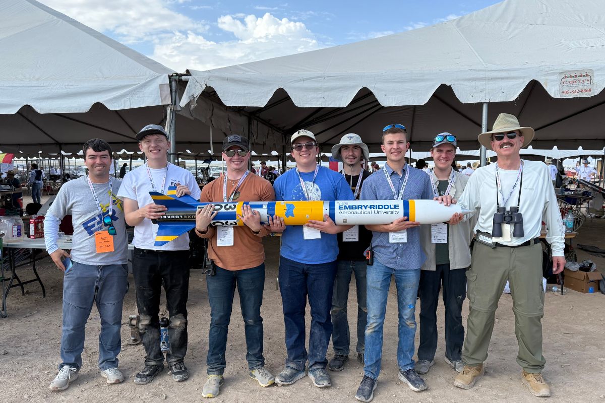 Team members from Embry-Riddle’s Rocket Development Lab at the International Rocket Engineering Competition (IREC) in Midland, Texas. Holding the team’s rocket (from left to right) are: alumnus Bryce Chanes (’18); students Quentin Trull, Shea Schmidt, Chase Ahrens, Kevin Wise, Ben Lambertson, Calvin Lindemann; and Professor Mark Benton, the team’s faculty advisor.