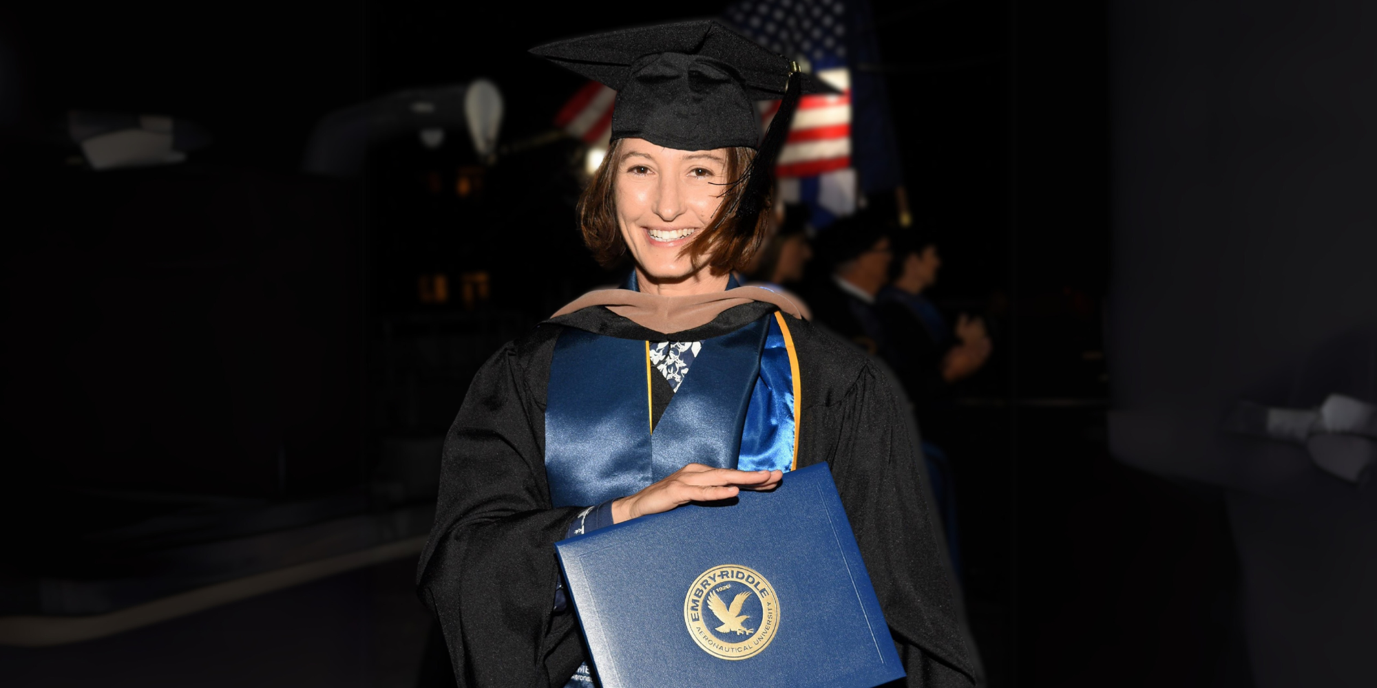 Andrea accepting her diploma